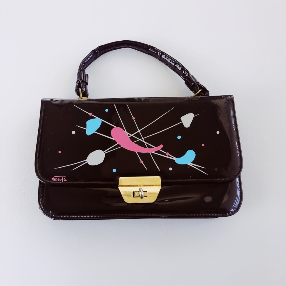 Vintage black patent purse with atomic print